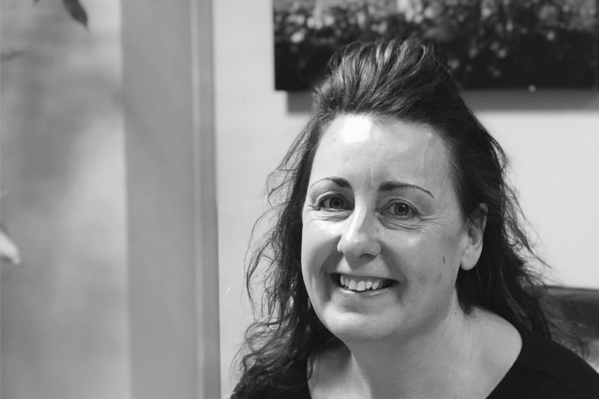 photograph of two hands holding fingers